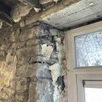Window reveal exposed prior to repair and installation of internal wall insulation (IWI)